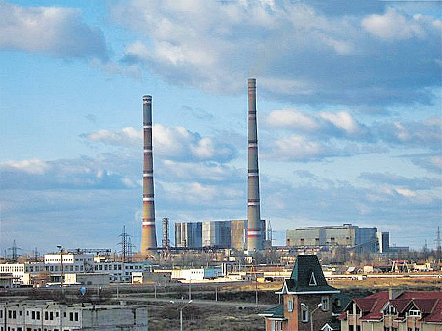 Thermal power plant with two tall chimneys.